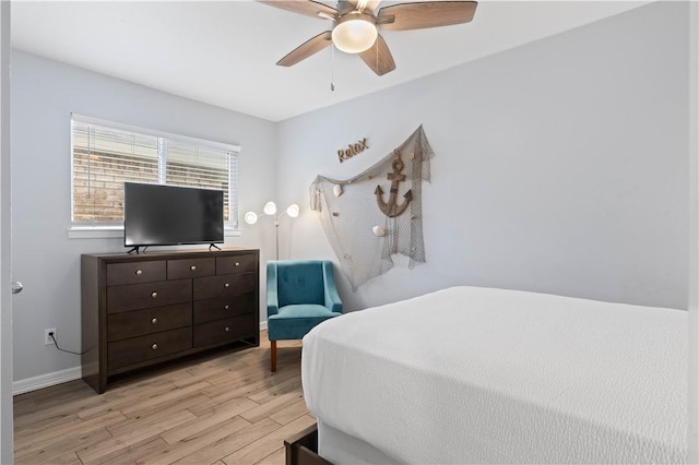 bedroom featuring ceiling fan and light hardwood / wood-style flooring