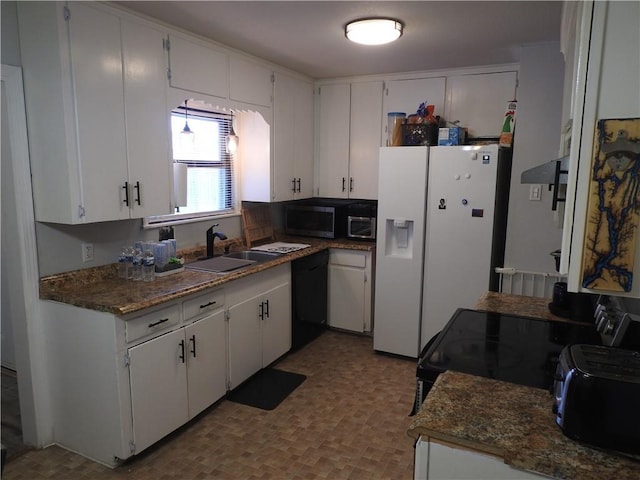 kitchen with white cabinets, white refrigerator with ice dispenser, and sink