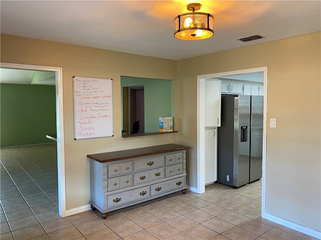 interior space featuring light tile patterned flooring