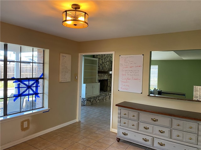 corridor with light tile patterned flooring