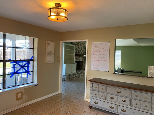 corridor with light tile patterned flooring