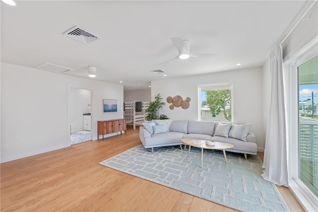 416 E Ave C Ave, Port Aransas, TX 78373 - living area featuring ceiling fan, light wood-style flooring, and baseboards