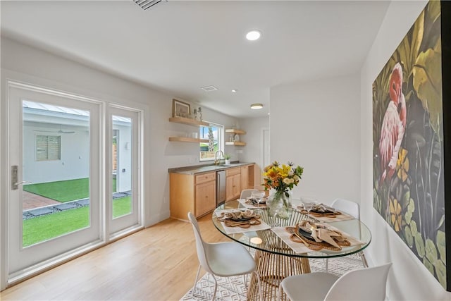 416 E Ave C Ave, Port Aransas, TX 78373 - dining room with light wood-type flooring and recessed lighting