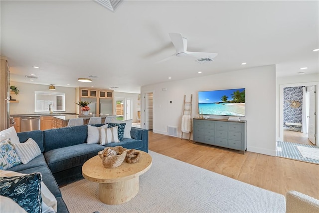 416 E Ave C Ave, Port Aransas, TX 78373 - living room featuring light wood-type flooring, recessed lighting, a ceiling fan, and baseboards