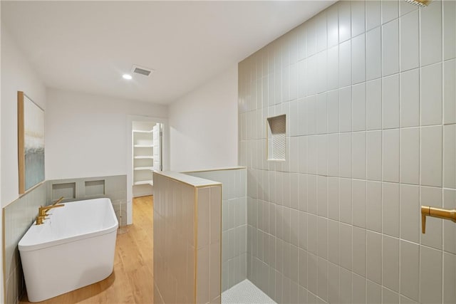 416 E Ave C Ave, Port Aransas, TX 78373 - full bathroom featuring wood finished floors, a walk in shower, and recessed lighting