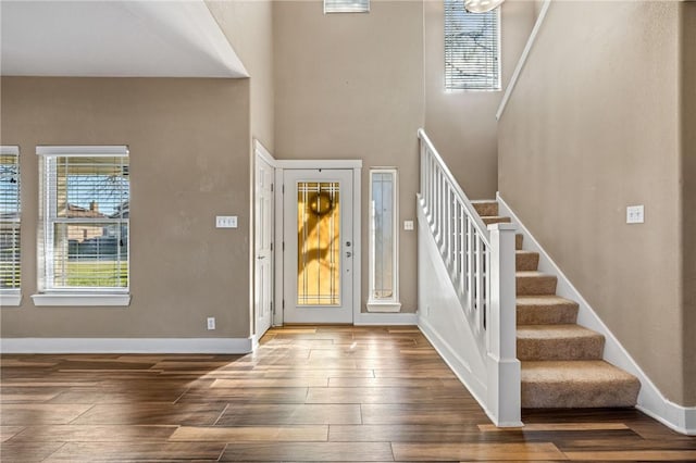 foyer with dark hardwood / wood-style floors