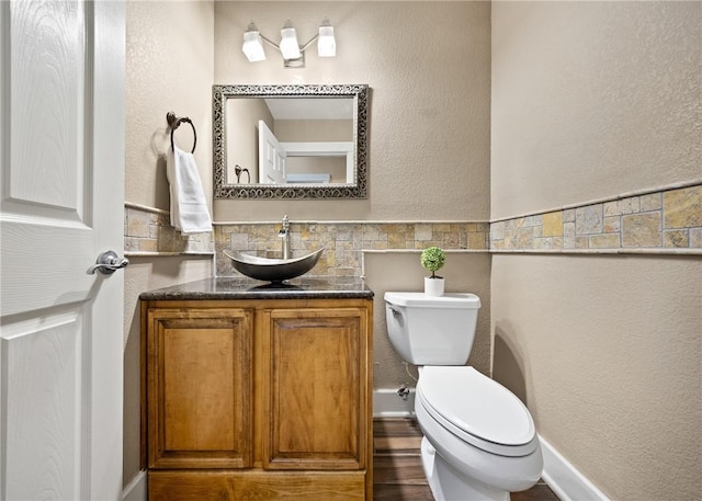 bathroom featuring toilet and vanity