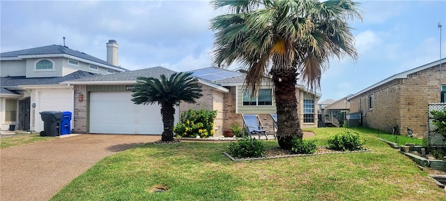 view of front facade featuring a front lawn and a garage