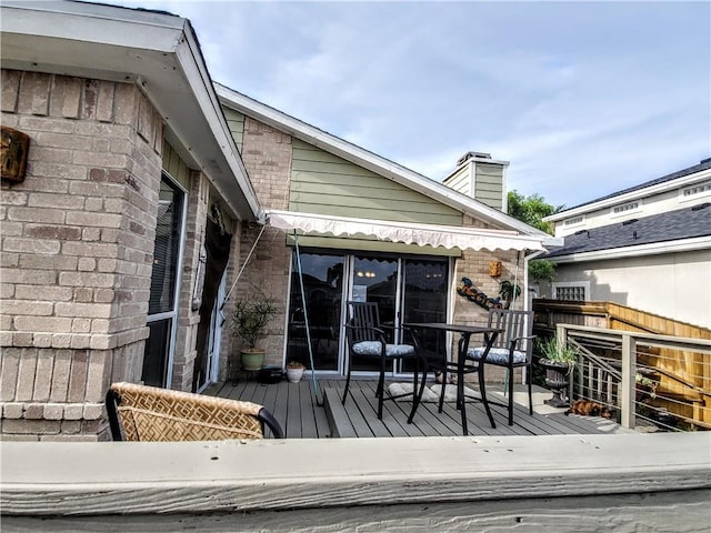 wooden terrace featuring fence