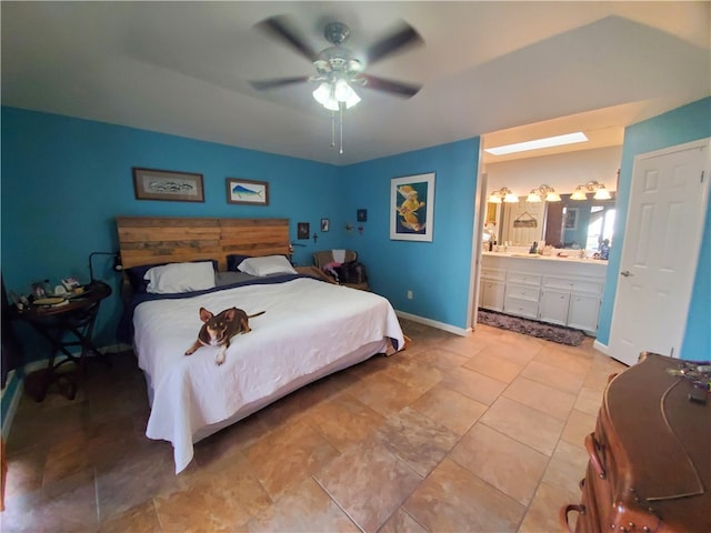 bedroom with ensuite bath and ceiling fan