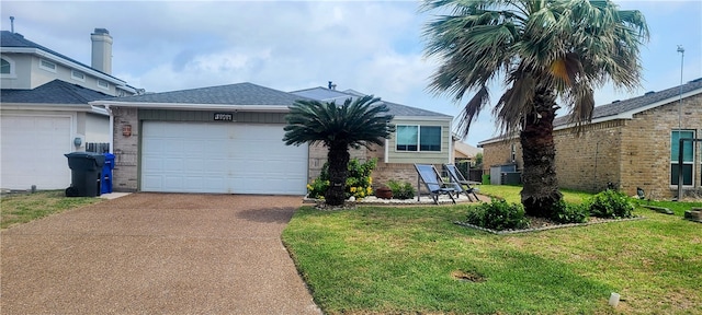 view of front of home featuring a garage and a front yard