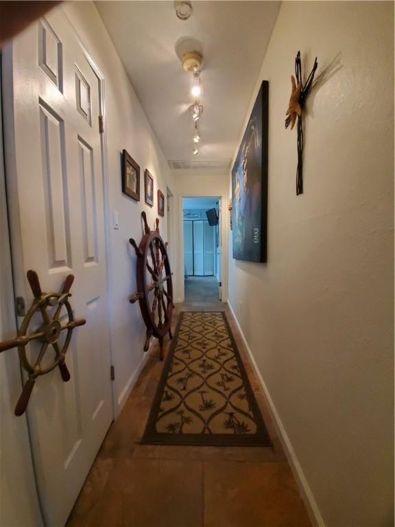 corridor featuring baseboards