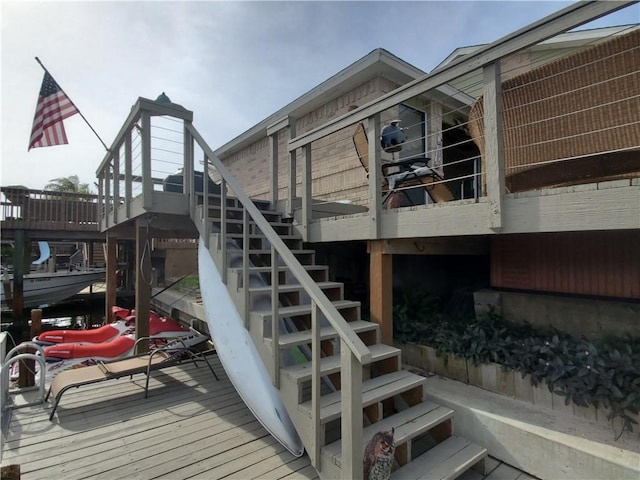 wooden terrace featuring stairs