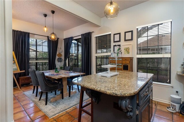 dining space with a textured ceiling