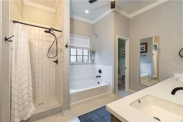 full bathroom featuring crown molding, shower with separate bathtub, and toilet