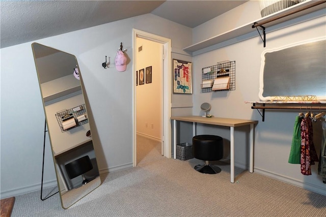 interior space with lofted ceiling and light colored carpet