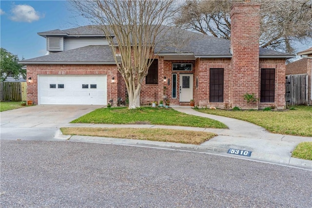 view of front facade featuring a garage and a front lawn