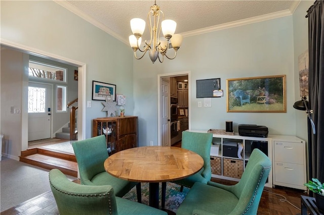 dining area with an inviting chandelier, crown molding, dark parquet flooring, and a textured ceiling