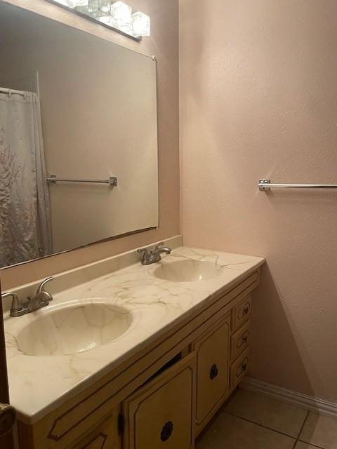 bathroom featuring vanity and tile patterned floors