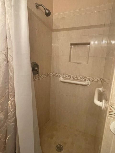 bathroom with a shower with curtain