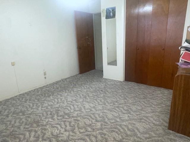 carpeted bedroom with a closet