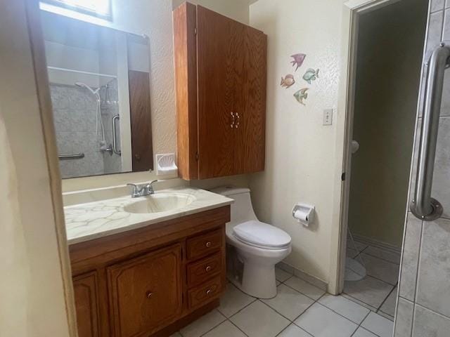 bathroom with walk in shower, tile patterned floors, vanity, and toilet