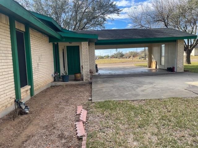 exterior space featuring a carport