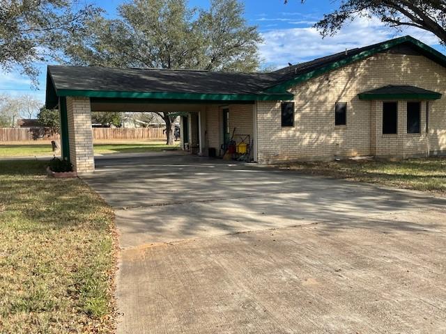 exterior space featuring a carport