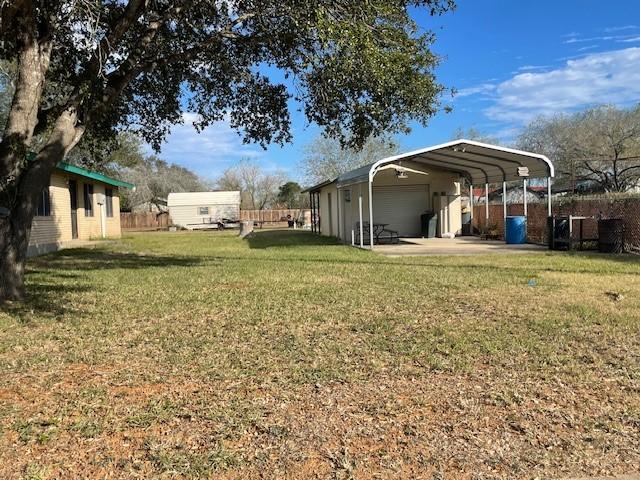 view of yard with a carport