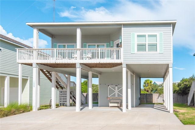 raised beach house featuring a carport