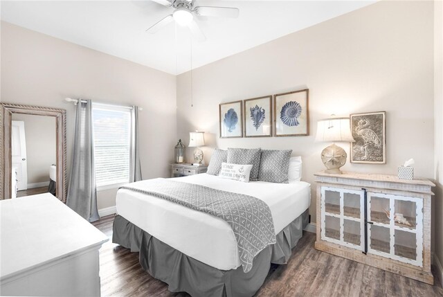 bedroom featuring dark wood-type flooring and ceiling fan