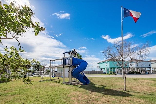 view of jungle gym with a lawn