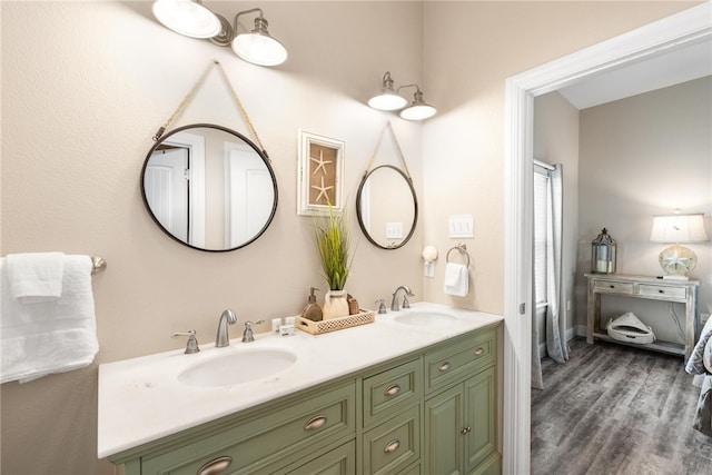 bathroom with hardwood / wood-style floors and vanity