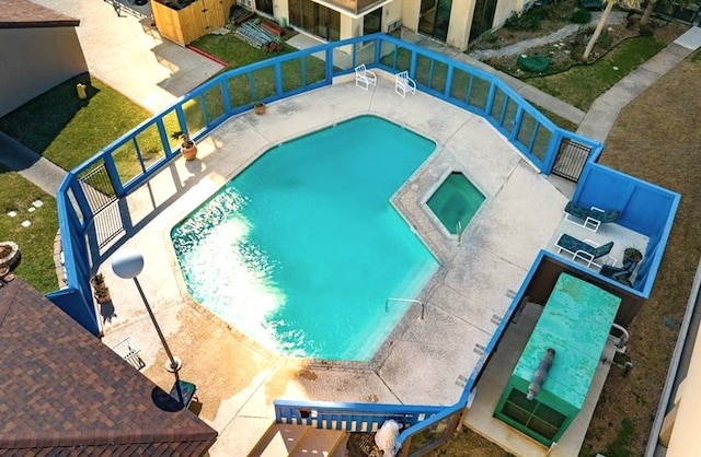 view of swimming pool featuring a patio