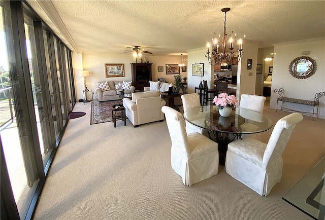 dining area featuring ornamental molding, ceiling fan with notable chandelier, light carpet, and a textured ceiling