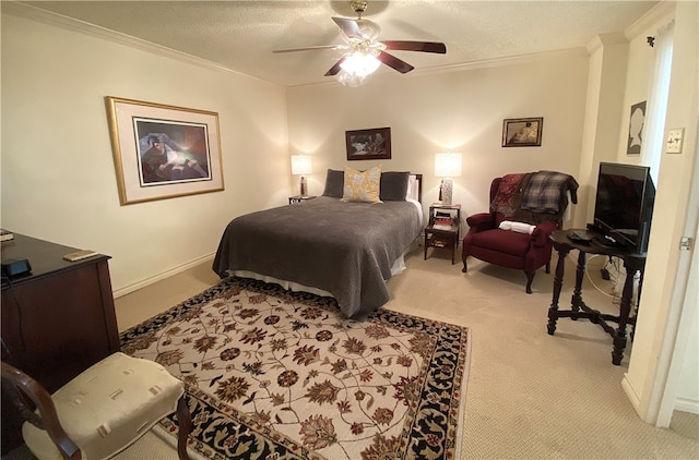 bedroom featuring a textured ceiling, light colored carpet, ceiling fan, and crown molding