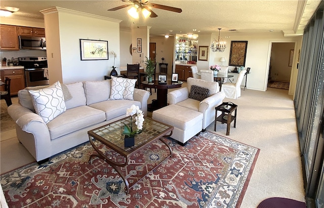 carpeted living room featuring a textured ceiling, ornamental molding, and ceiling fan with notable chandelier