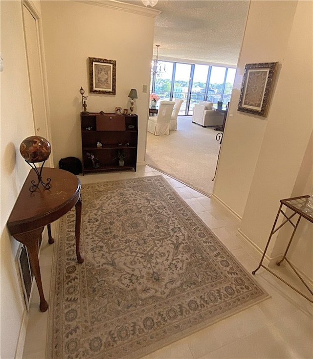 hallway featuring a wall of windows and a notable chandelier