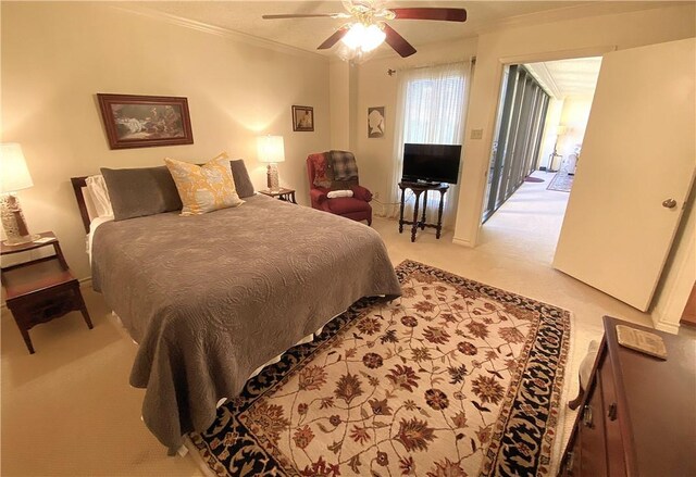 1400 Ocean Dr Unit 503-C, Corpus Christi, TX 78404 - bedroom with ornamental molding, light colored carpet, and a ceiling fan