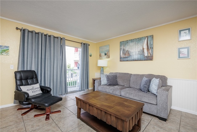 living room with a textured ceiling, light tile patterned floors, and crown molding