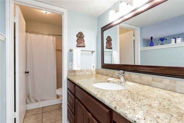 bathroom with toilet, tile patterned floors, a textured ceiling, a shower with curtain, and vanity