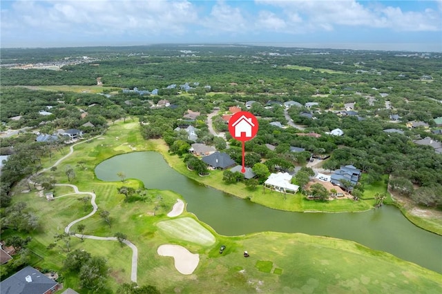 drone / aerial view with a water view, golf course view, and a residential view