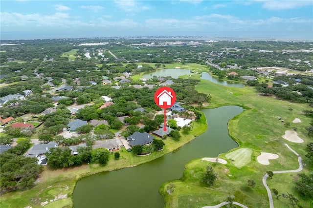 drone / aerial view featuring a water view, a residential view, and view of golf course