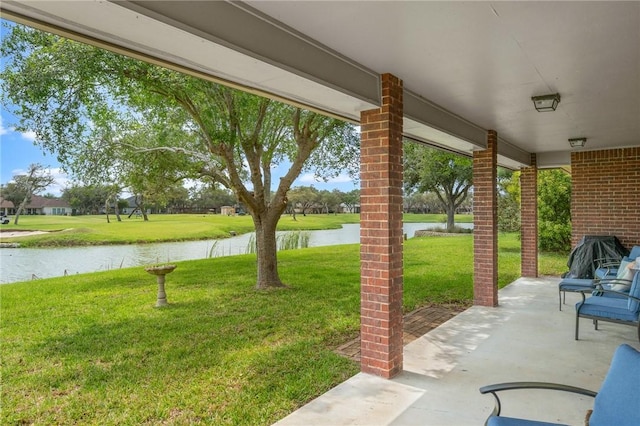 view of patio featuring a water view