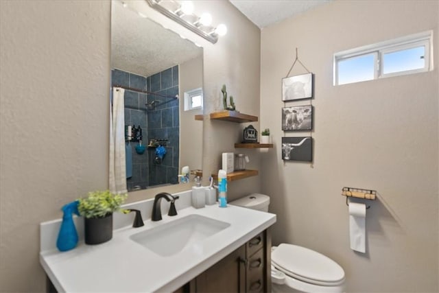 4622 Bluebelle Ln, Corpus Christi, TX 78416 - full bathroom featuring toilet, healthy amount of natural light, vanity, and a tile shower