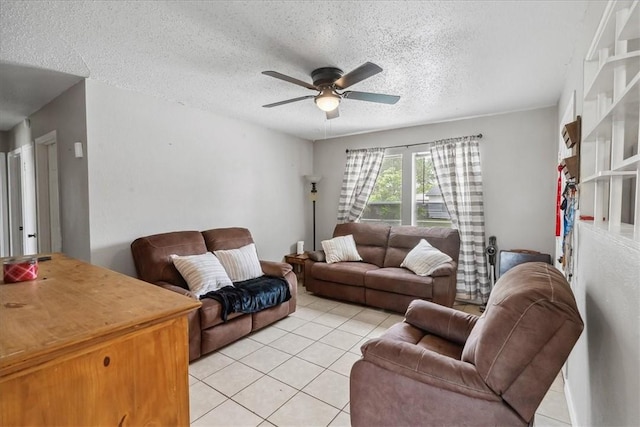 4622 Bluebelle Ln, Corpus Christi, TX 78416 - living room with light tile patterned floors, a ceiling fan, and a textured ceiling
