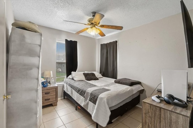 4622 Bluebelle Ln, Corpus Christi, TX 78416 - bedroom with a textured ceiling, a ceiling fan, and light tile patterned floors