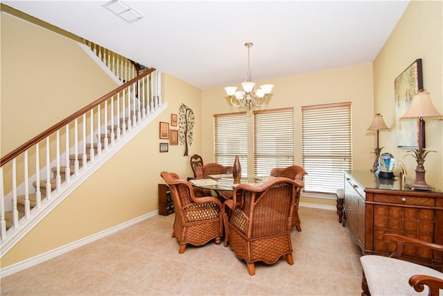 dining space with baseboards, visible vents, stairs, a chandelier, and light tile patterned flooring