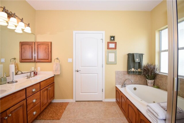 kitchen with dishwasher, open floor plan, light stone countertops, black electric stovetop, and a sink