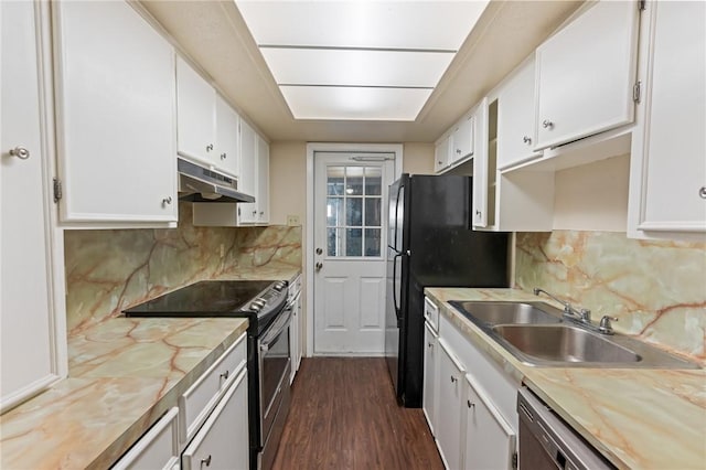 kitchen featuring light countertops, electric stove, white cabinets, and under cabinet range hood